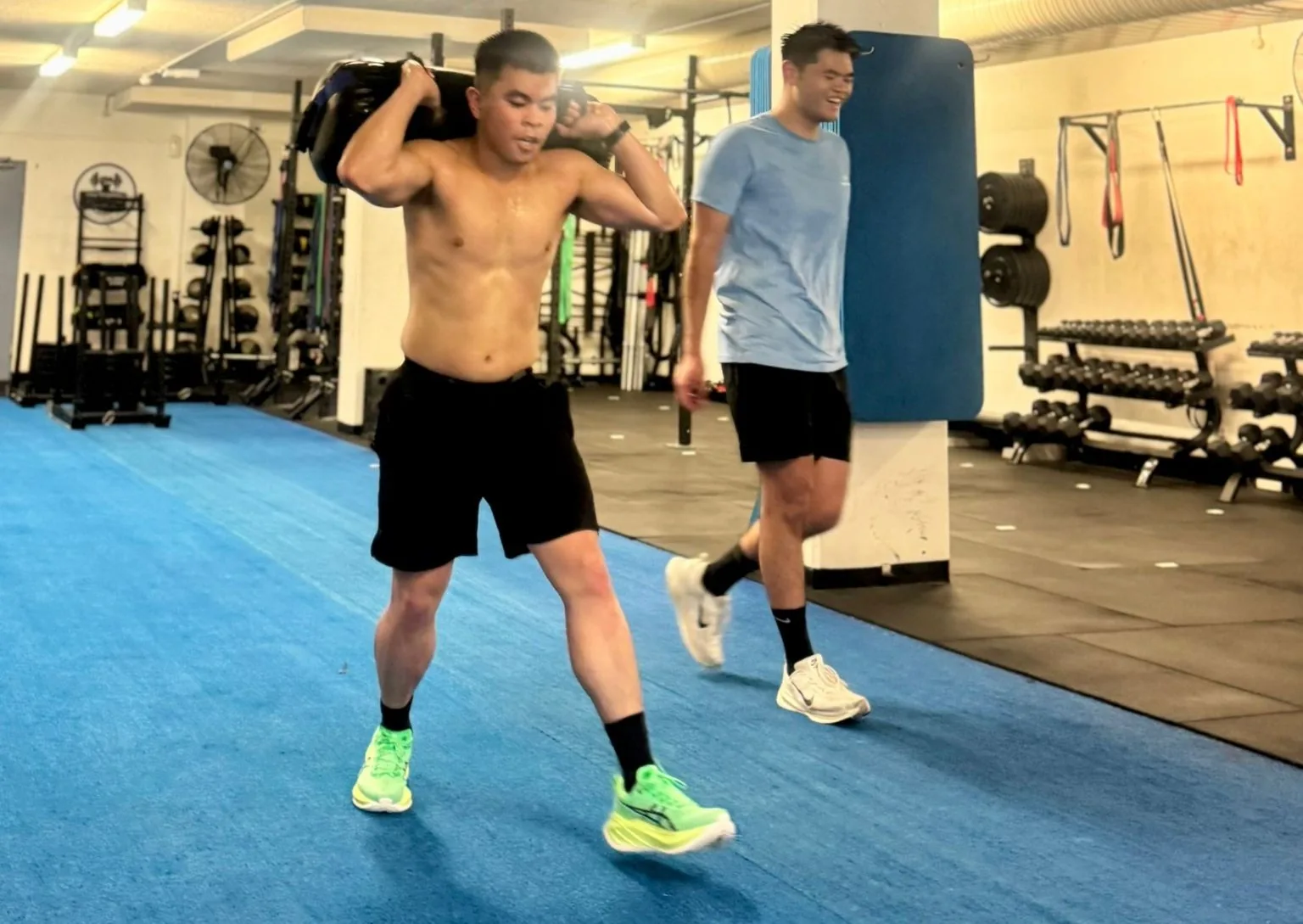 Members sandbag lunges at Team Transform